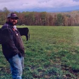 cattle farmer in field